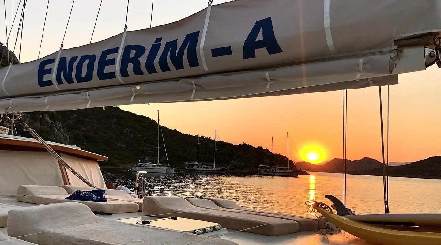 Enderim A gulet at sunset docked with a calm sea