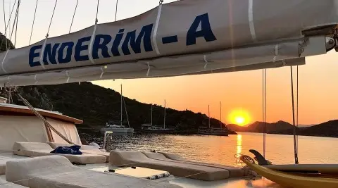 Enderim A gulet at sunset docked with a calm sea