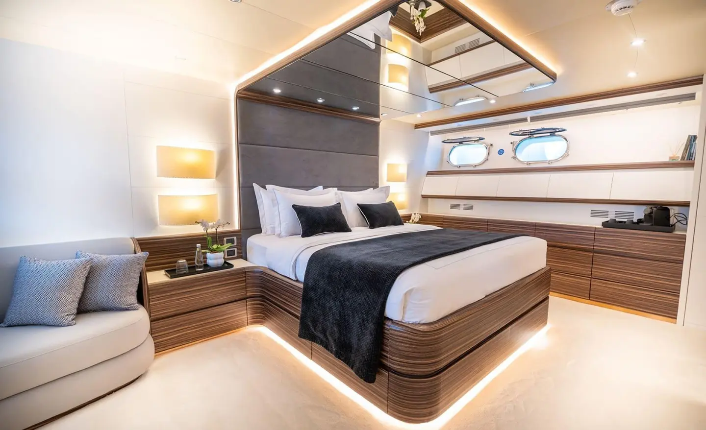 Pareaki II master cabin with large bed, wood accents, and window view