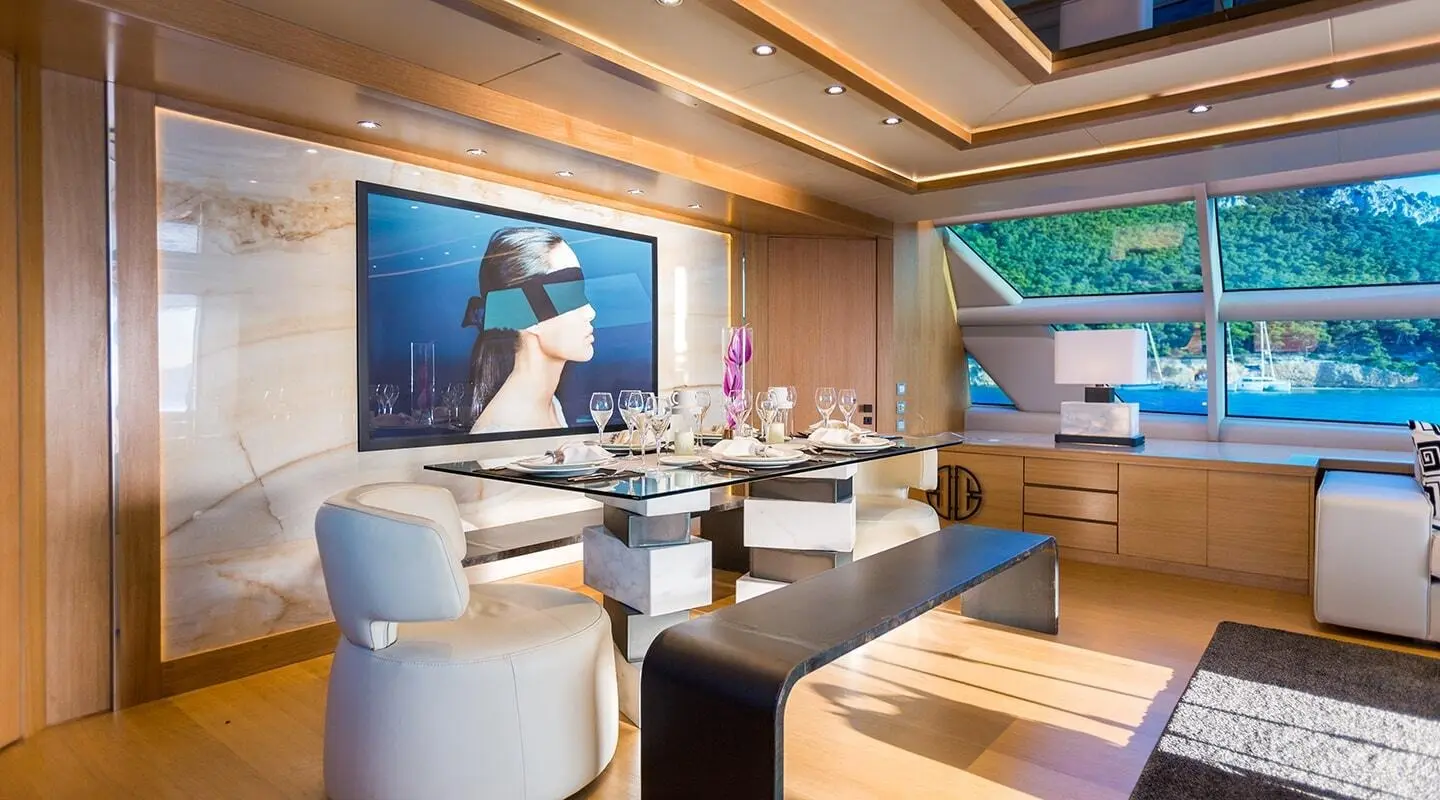 Luxurious yacht dining area aboard Aquarella during sunset with table settings