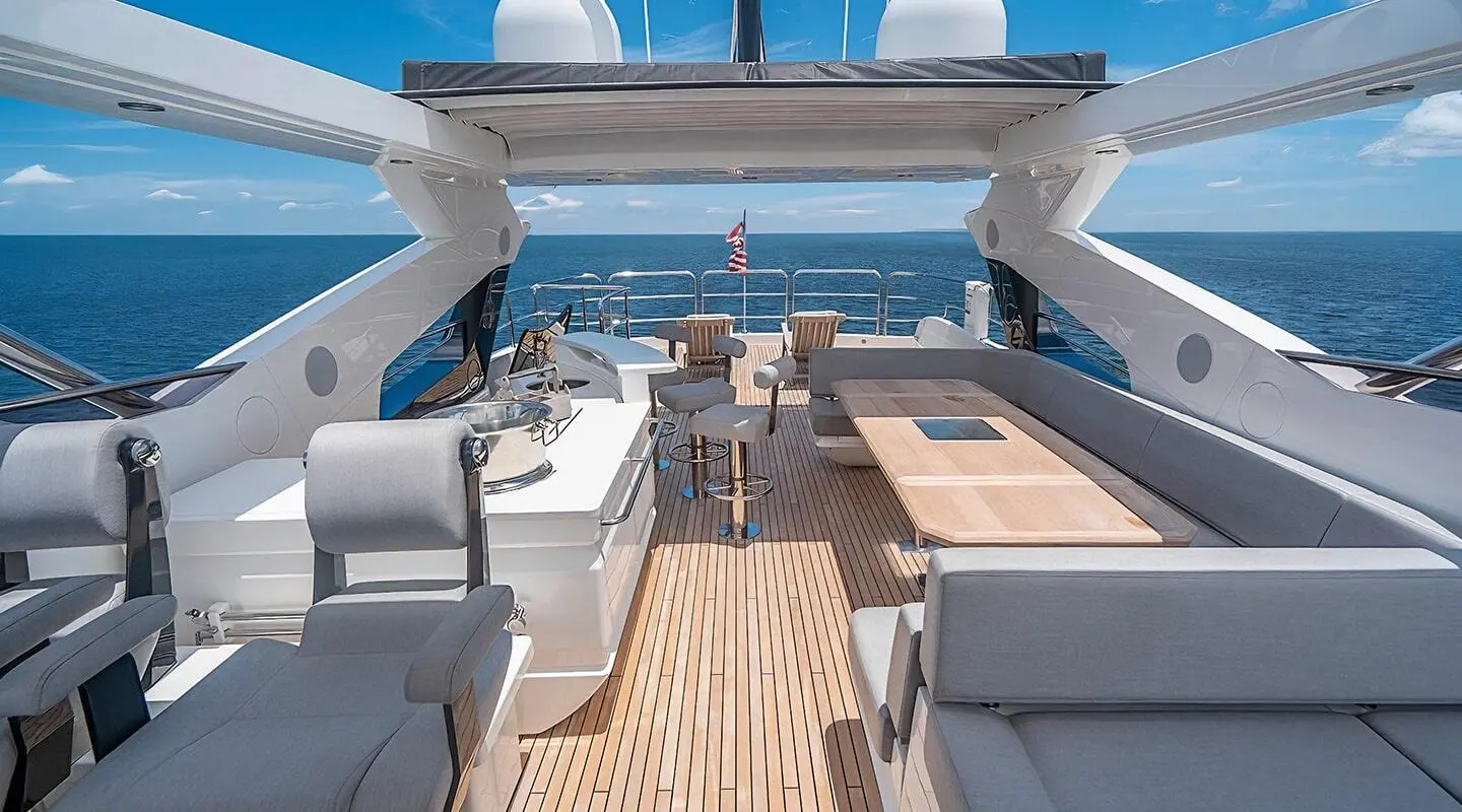 Quantum motor yacht flybridge with wooden deck and seating area visible