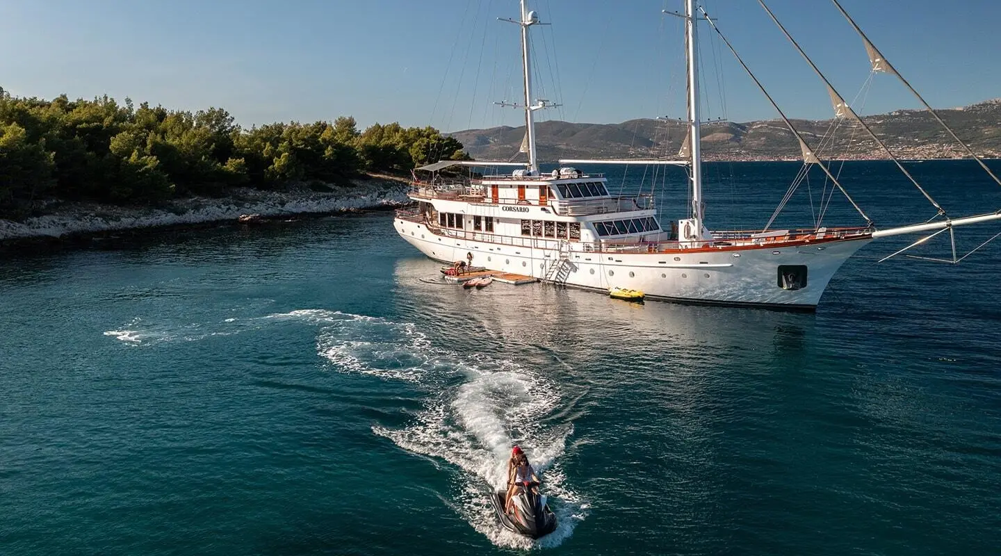 Corsario luxury gulet yacht anchored in turquoise harbor at sunset