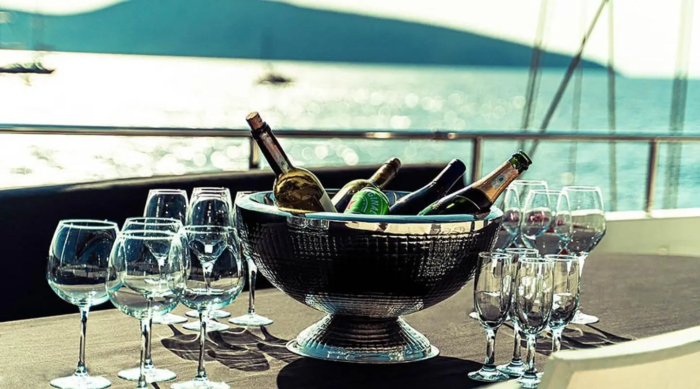 Virtuoso yacht on calm sea with a shaded deck and a central ornate centerpiece