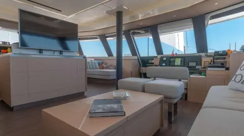 Serenissima yacht interior cockpit with seating, helm, and panoramic windows