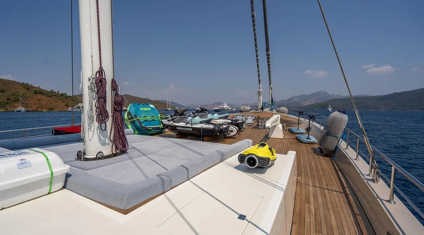 View from forward deck of De Love yacht with a calm marina and moored boats