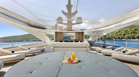 View from the bow forward deck of Bella yacht, sun loungers and seating seen