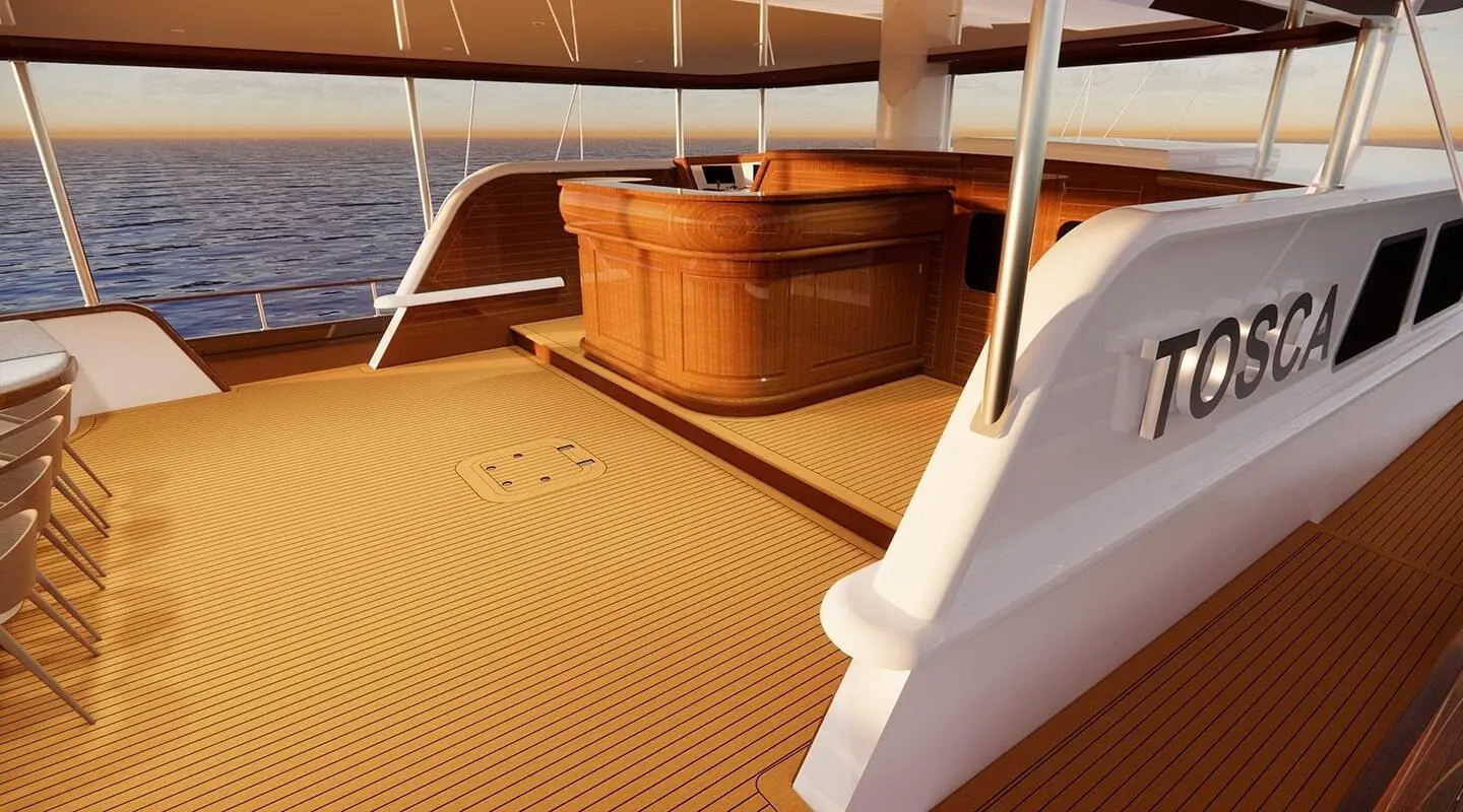 Yacht Tosca on calm sea at sunset, wooden deck and railing visible