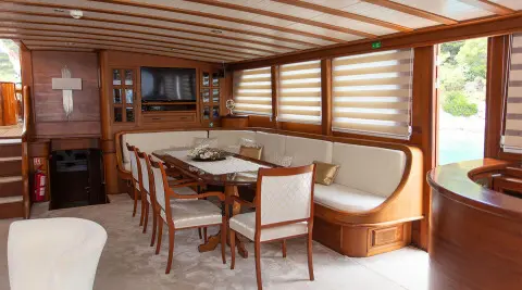 Dolce Vita yacht balcony dining area with wooden pergola and table setup