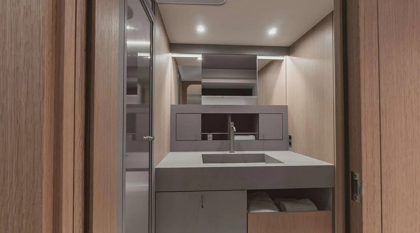 Nadamas luxury yacht interior with modern galley, cabinets, and lighting at dusk