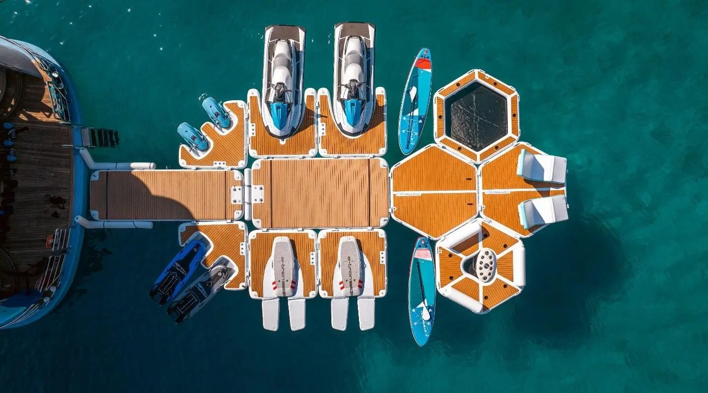 Overhead view of a luxury yacht named Freedom docked at a marina
